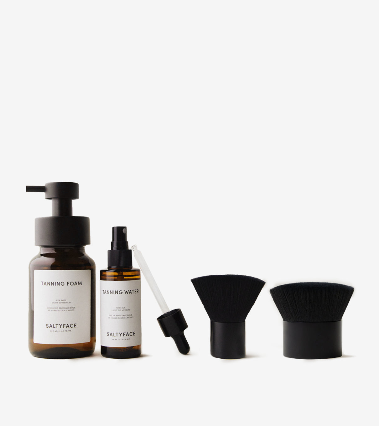 Saltyface Tanning Foam, Saltyface Tanning Water with Mist Top, Dropper Applicator, Brush No. 1 and Brush No. 2.