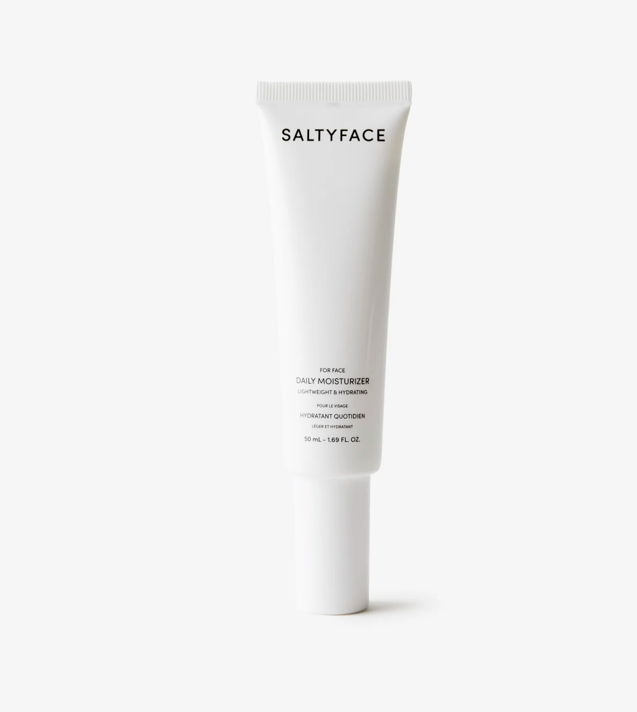 Tube of Saltyface Daily Moisturizer standing upright against a white backdrop. 